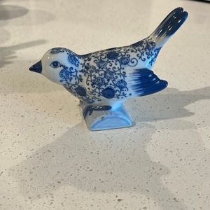 Small blue and white bird trinket